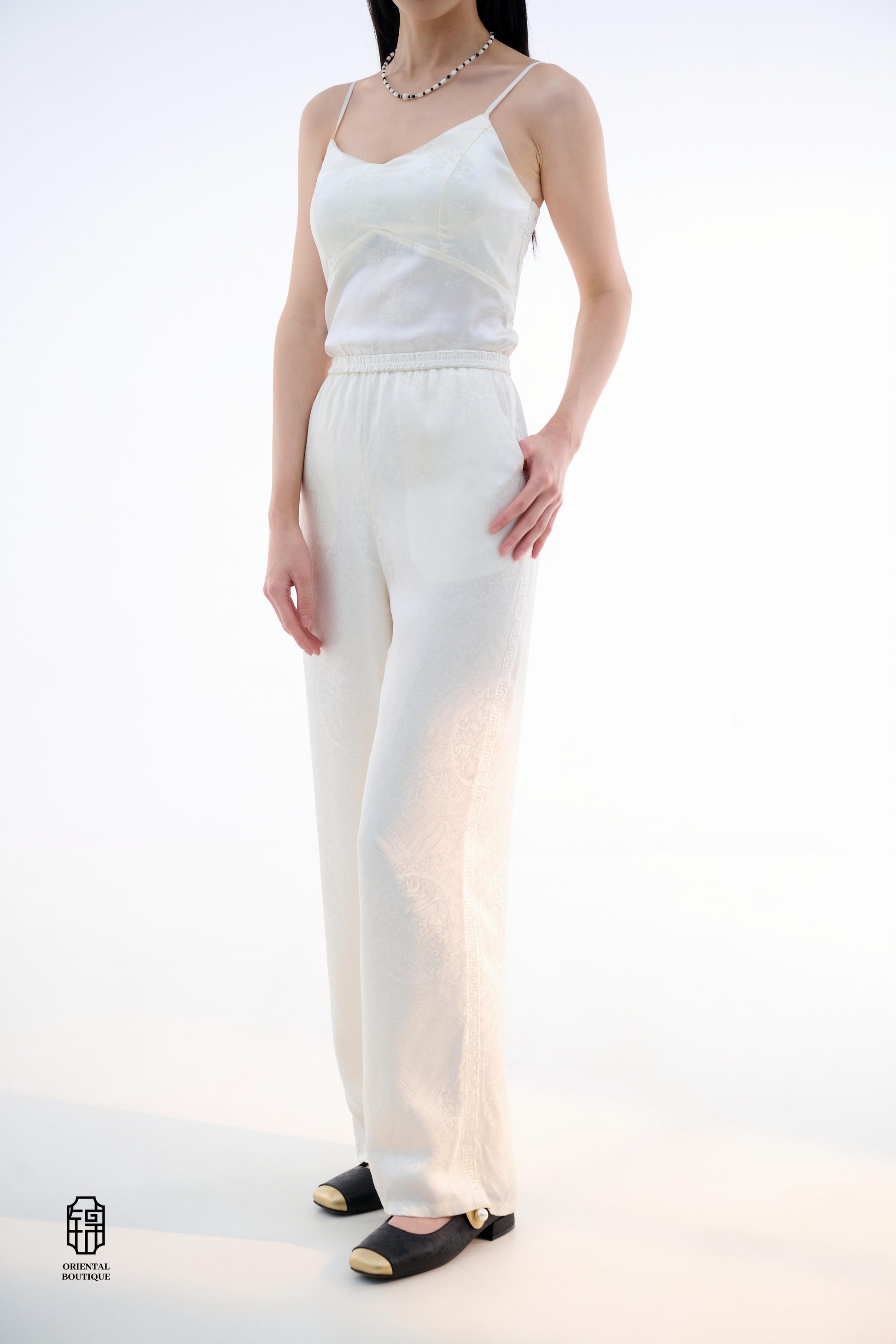 Brocade Trousers,These pants come in two elegant options: ivory and mocha. Made from refined silk fabric with intricate jacquard patterns, they add a touch of luxury to any outfit. The minimalist design and loose fit offer a comfortable wearing experience