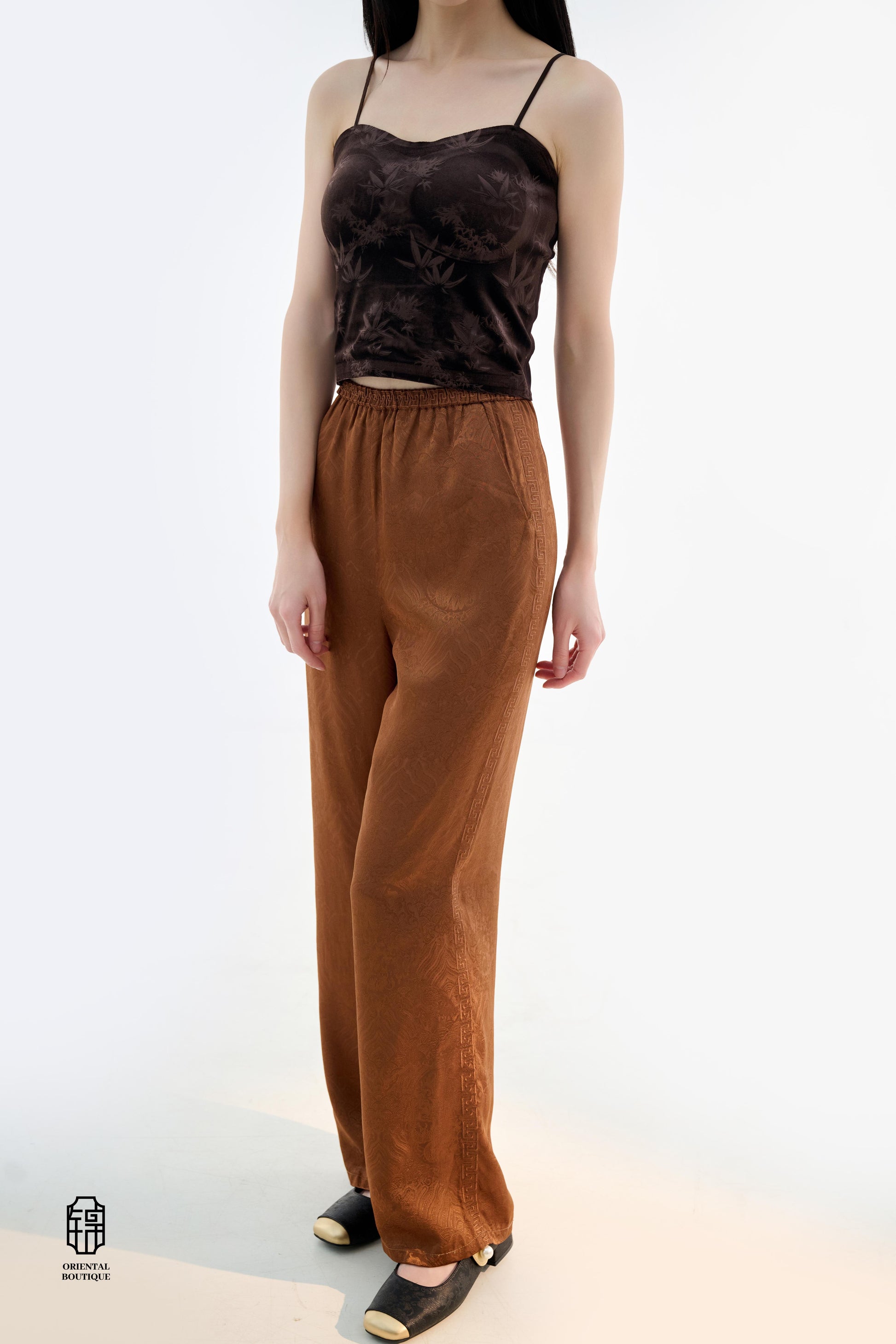 Brocade Trousers,These pants come in two elegant options: ivory and mocha. Made from refined silk fabric with intricate jacquard patterns, they add a touch of luxury to any outfit. The minimalist design and loose fit offer a comfortable wearing experience