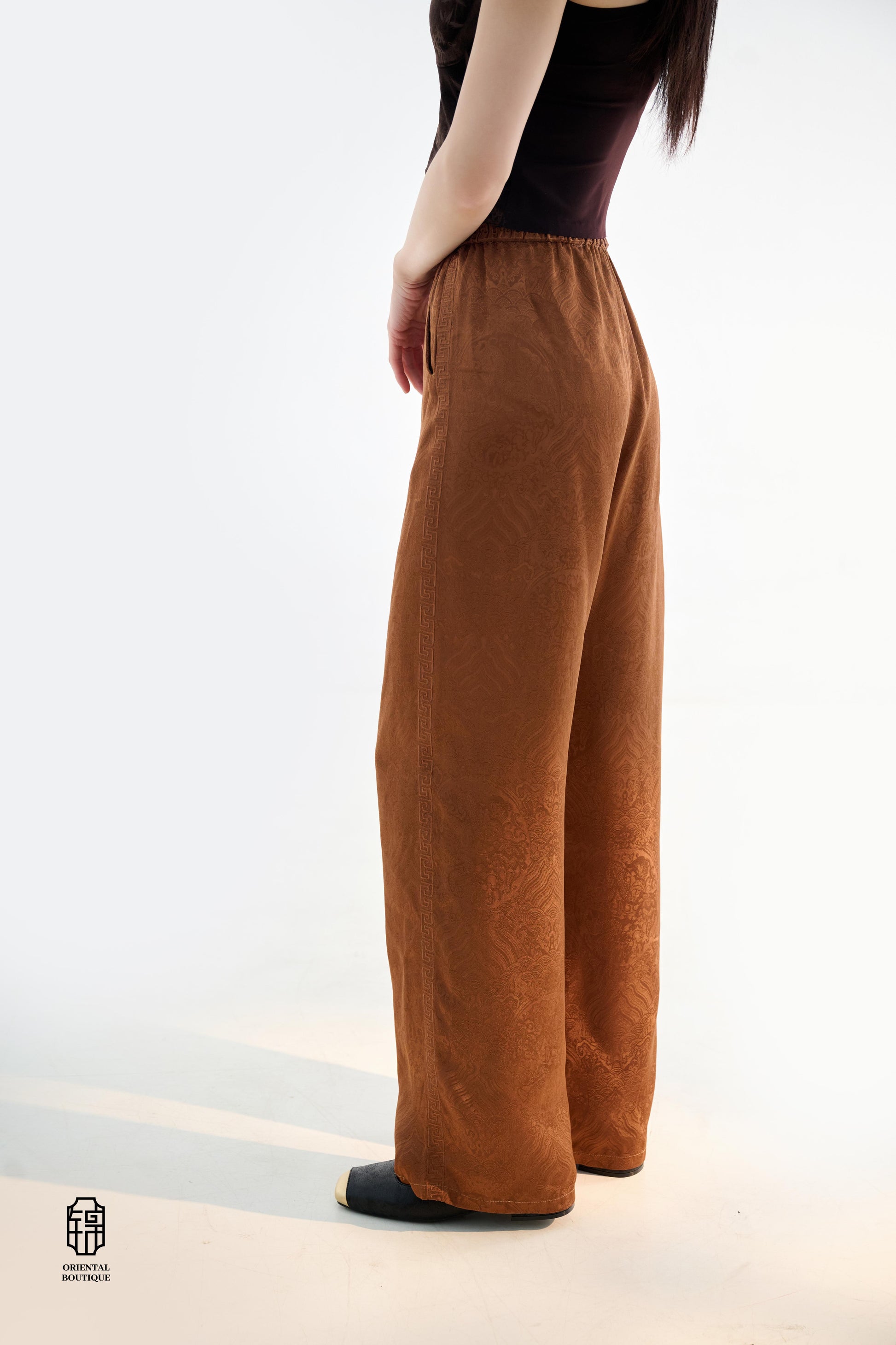 Brocade Trousers,These pants come in two elegant options: ivory and mocha. Made from refined silk fabric with intricate jacquard patterns, they add a touch of luxury to any outfit. The minimalist design and loose fit offer a comfortable wearing experience