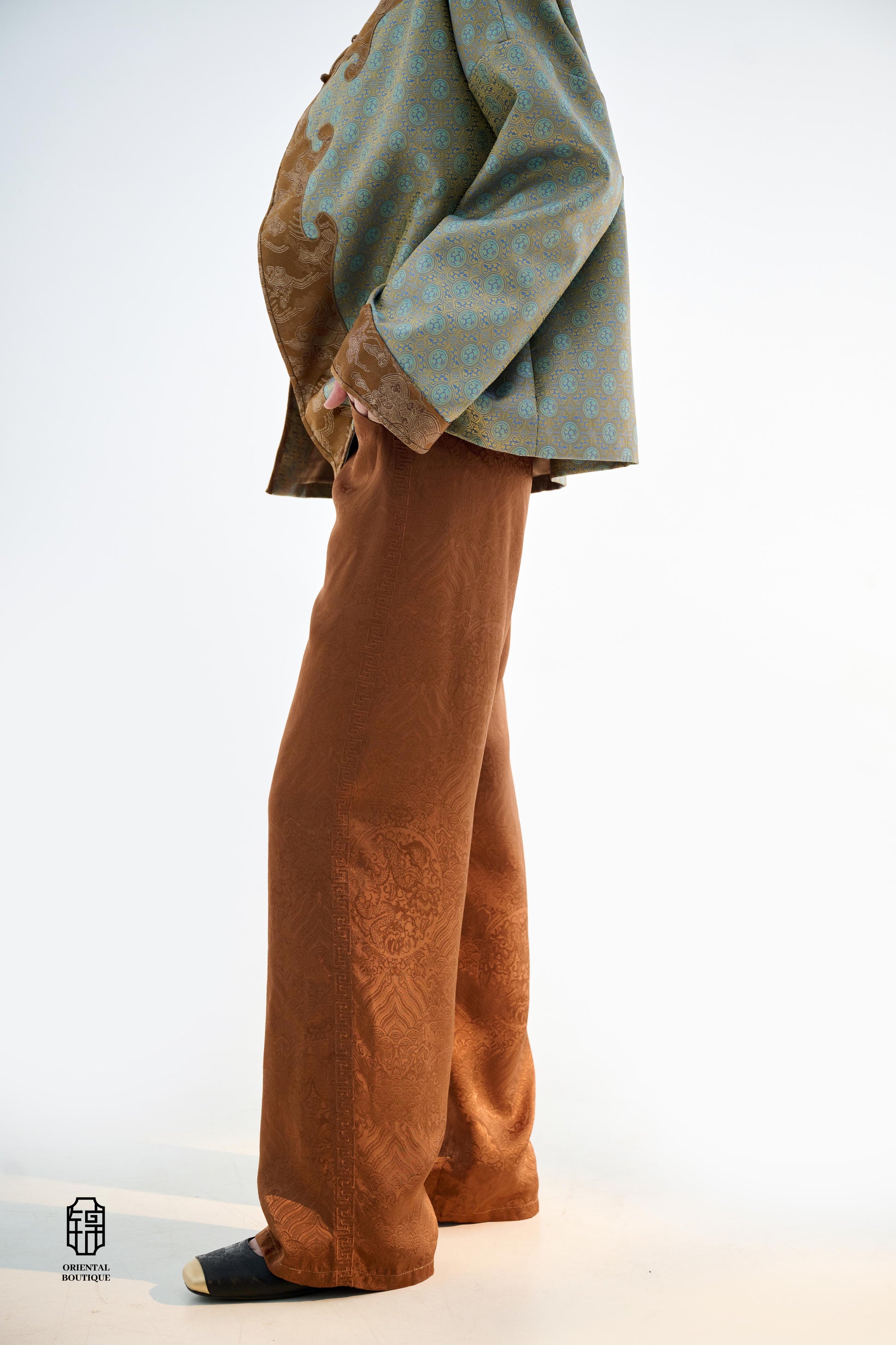 Brocade Trousers,These pants come in two elegant options: ivory and mocha. Made from refined silk fabric with intricate jacquard patterns, they add a touch of luxury to any outfit. The minimalist design and loose fit offer a comfortable wearing experience