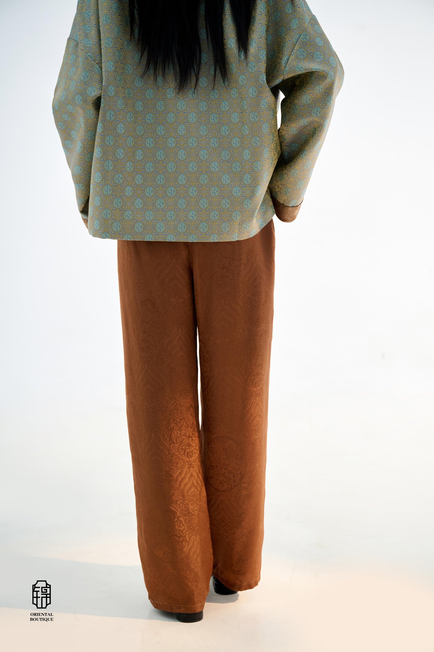 Brocade Trousers,These pants come in two elegant options: ivory and mocha. Made from refined silk fabric with intricate jacquard patterns, they add a touch of luxury to any outfit. The minimalist design and loose fit offer a comfortable wearing experience