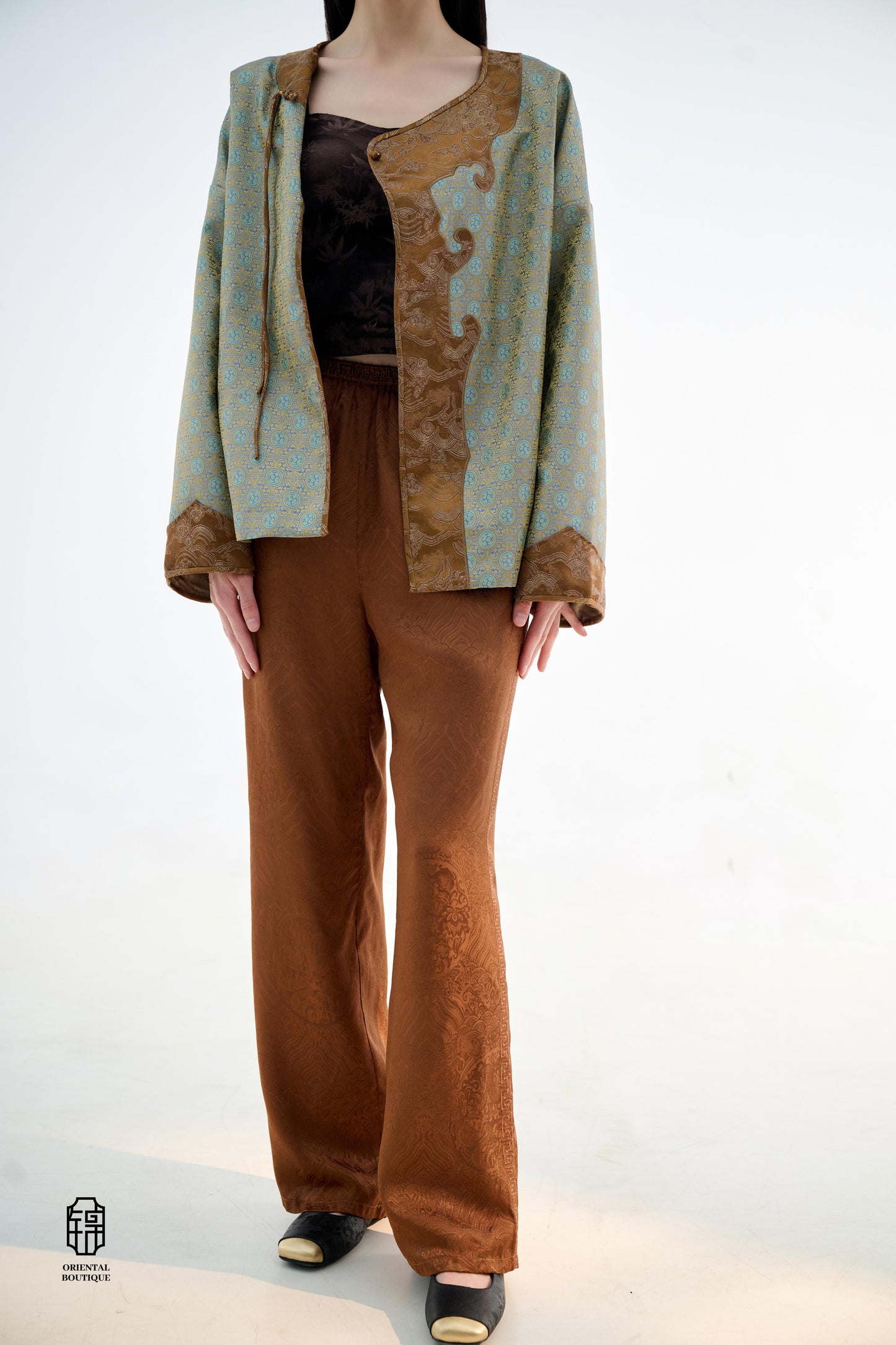 Brocade Trousers,These pants come in two elegant options: ivory and mocha. Made from refined silk fabric with intricate jacquard patterns, they add a touch of luxury to any outfit. The minimalist design and loose fit offer a comfortable wearing experience