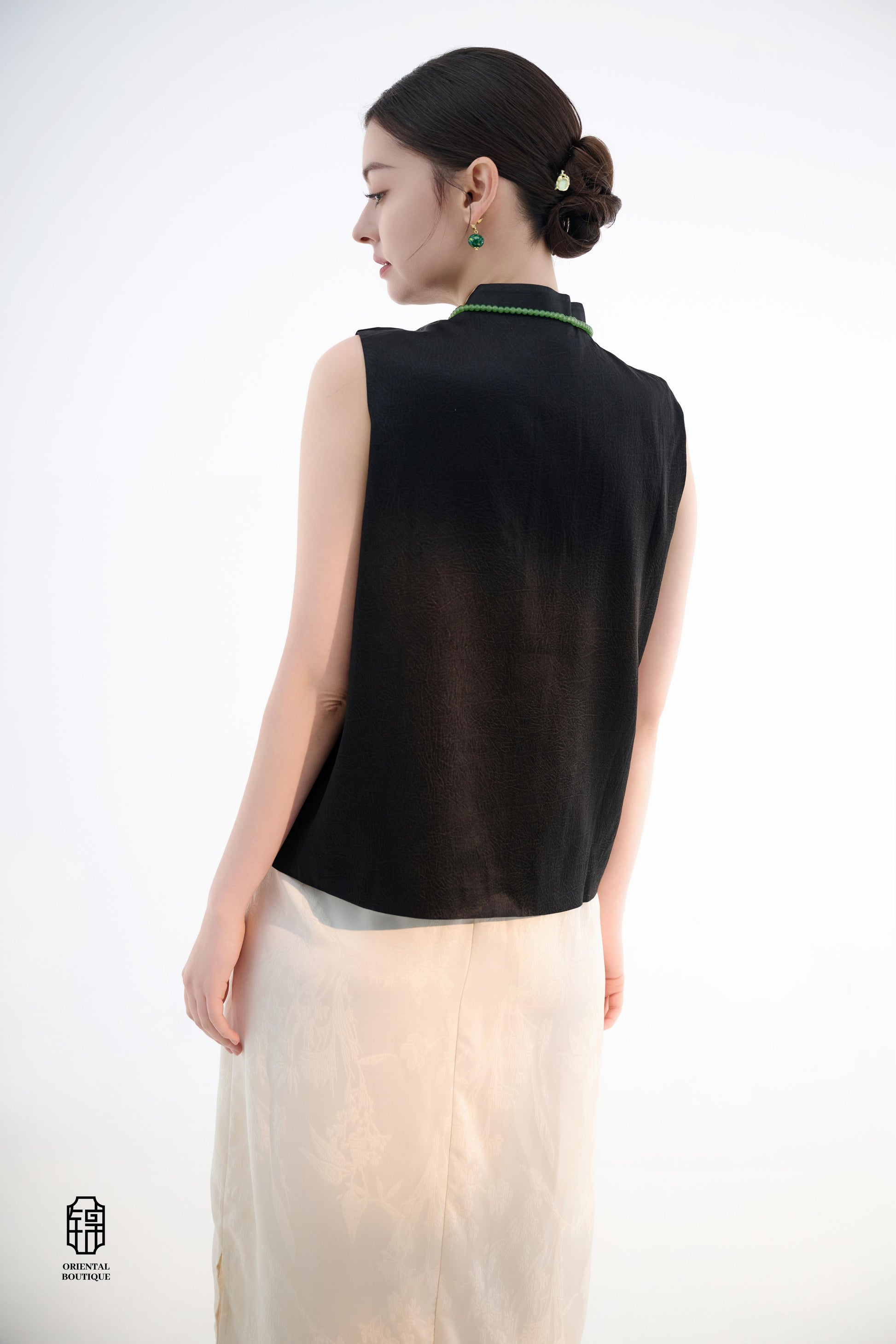 Black Lotus Sleeveless Top,The Black Lotus Sleeveless Top is a sophisticated sleeveless garment, featuring a sleek black tone crafted from luxurious silk fabric, offering a lightweight and smooth texture. The top is adorned with subtle jacquard embroidery