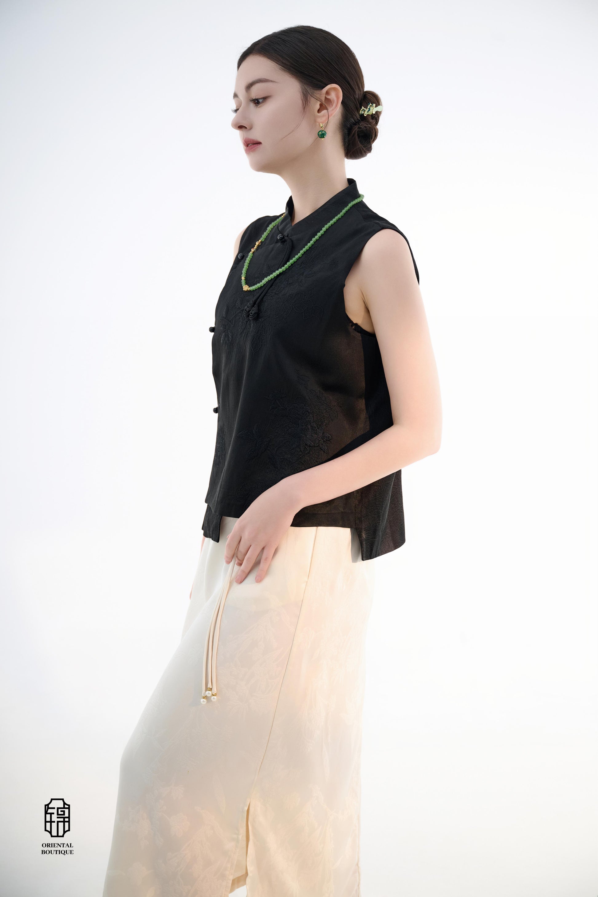 Black Lotus Sleeveless Top,The Black Lotus Sleeveless Top is a sophisticated sleeveless garment, featuring a sleek black tone crafted from luxurious silk fabric, offering a lightweight and smooth texture. The top is adorned with subtle jacquard embroidery