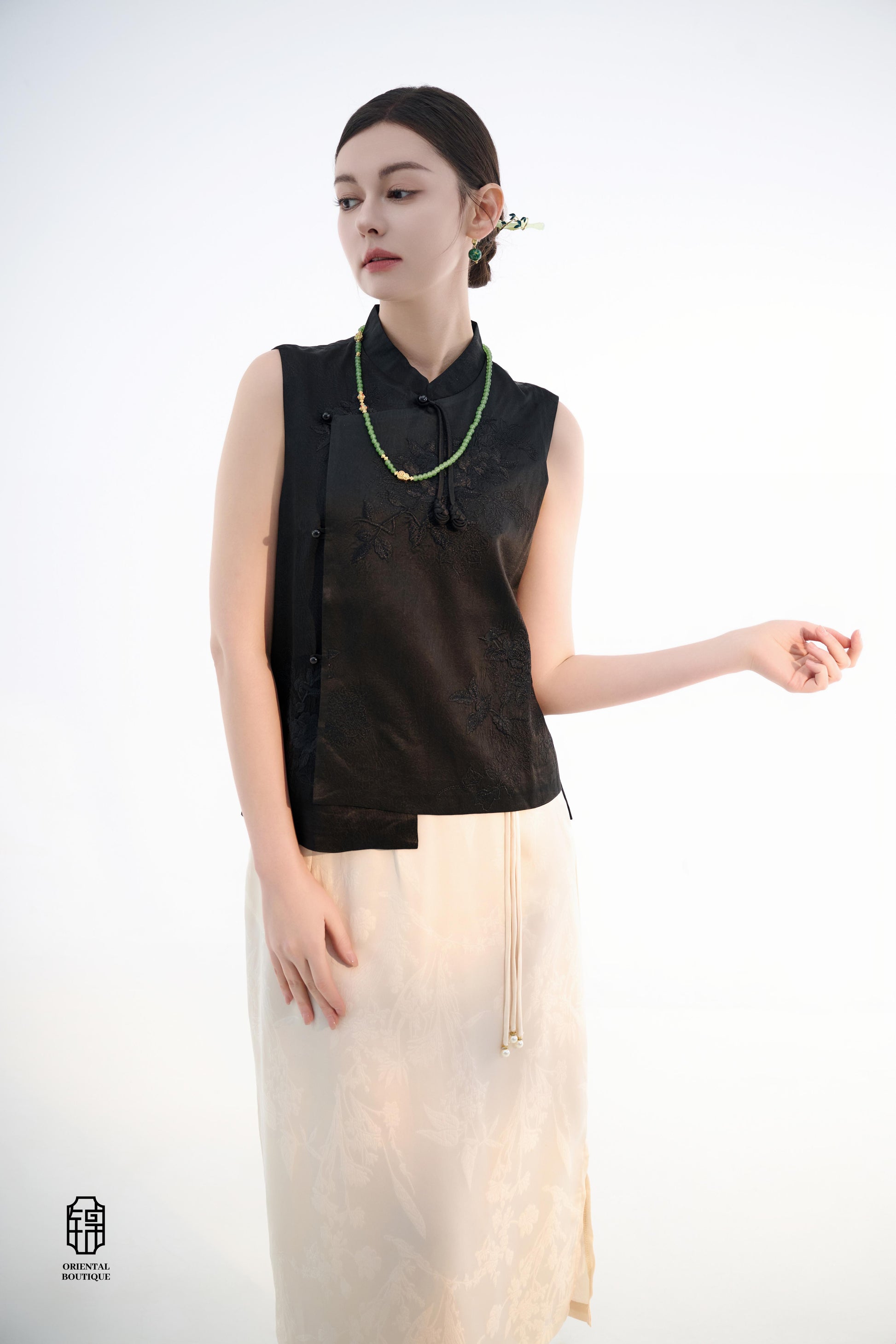 Black Lotus Sleeveless Top,The Black Lotus Sleeveless Top is a sophisticated sleeveless garment, featuring a sleek black tone crafted from luxurious silk fabric, offering a lightweight and smooth texture. The top is adorned with subtle jacquard embroidery
