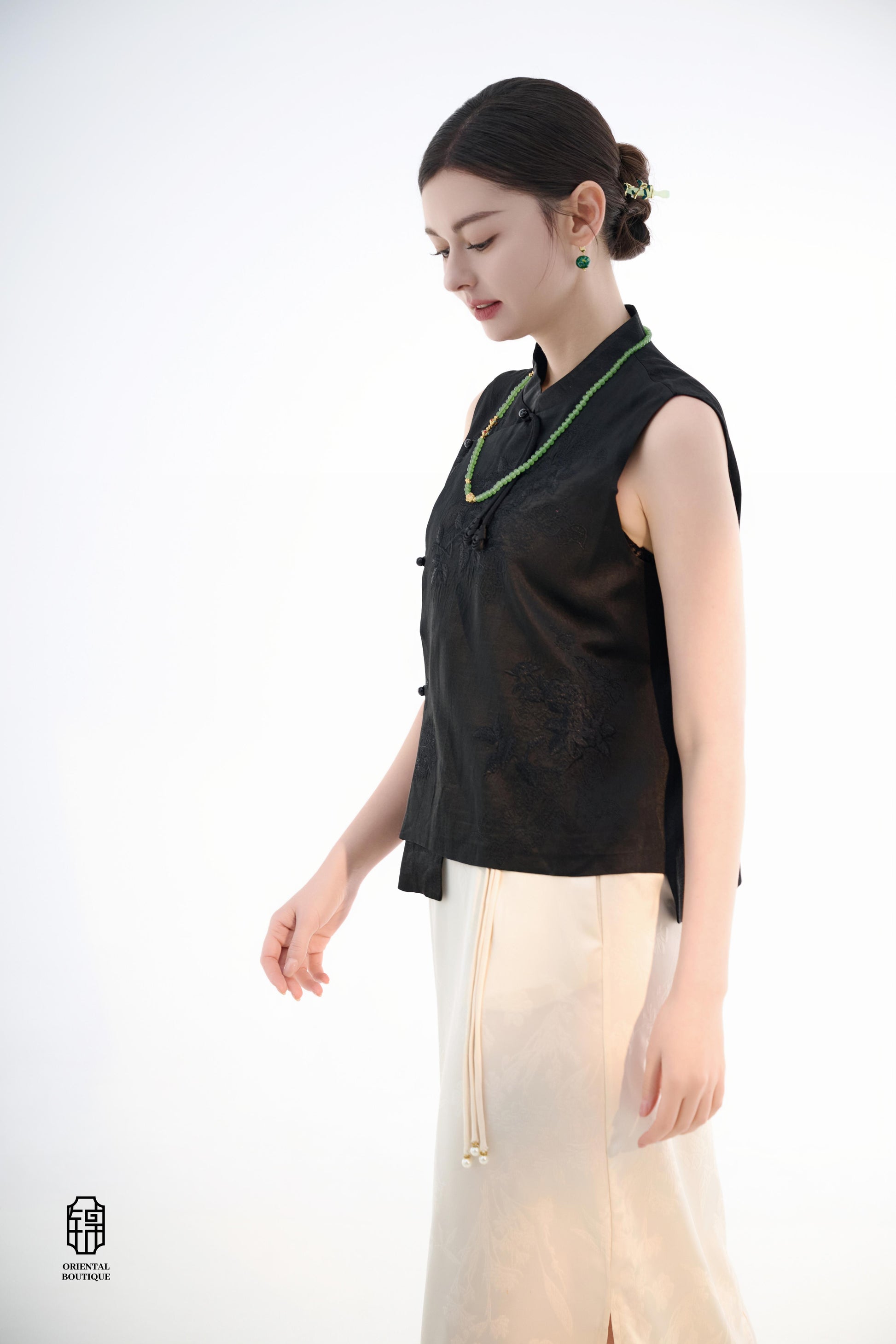 Black Lotus Sleeveless Top,The Black Lotus Sleeveless Top is a sophisticated sleeveless garment, featuring a sleek black tone crafted from luxurious silk fabric, offering a lightweight and smooth texture. The top is adorned with subtle jacquard embroidery