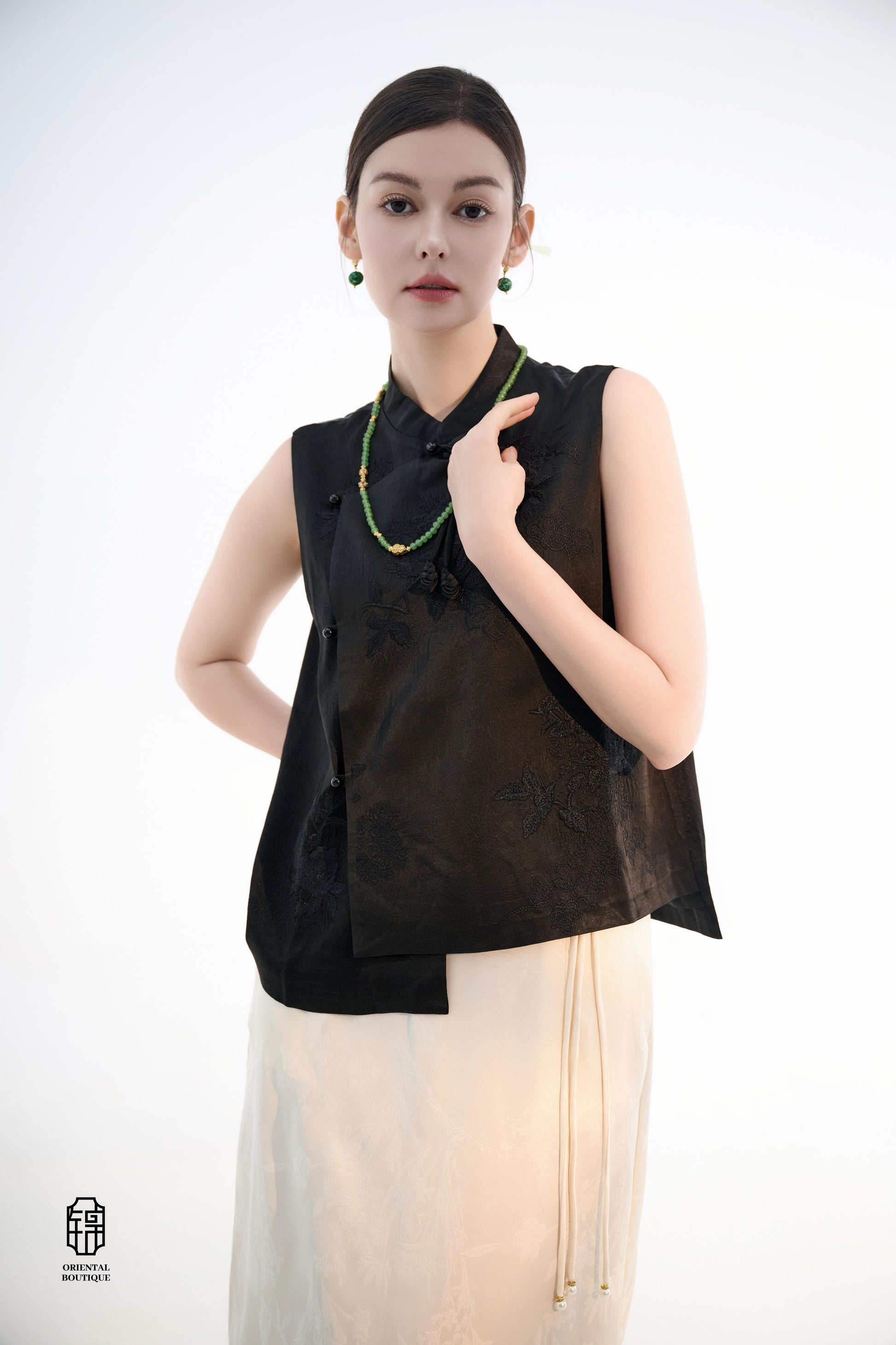 Black Lotus Sleeveless Top,The Black Lotus Sleeveless Top is a sophisticated sleeveless garment, featuring a sleek black tone crafted from luxurious silk fabric, offering a lightweight and smooth texture. The top is adorned with subtle jacquard embroidery