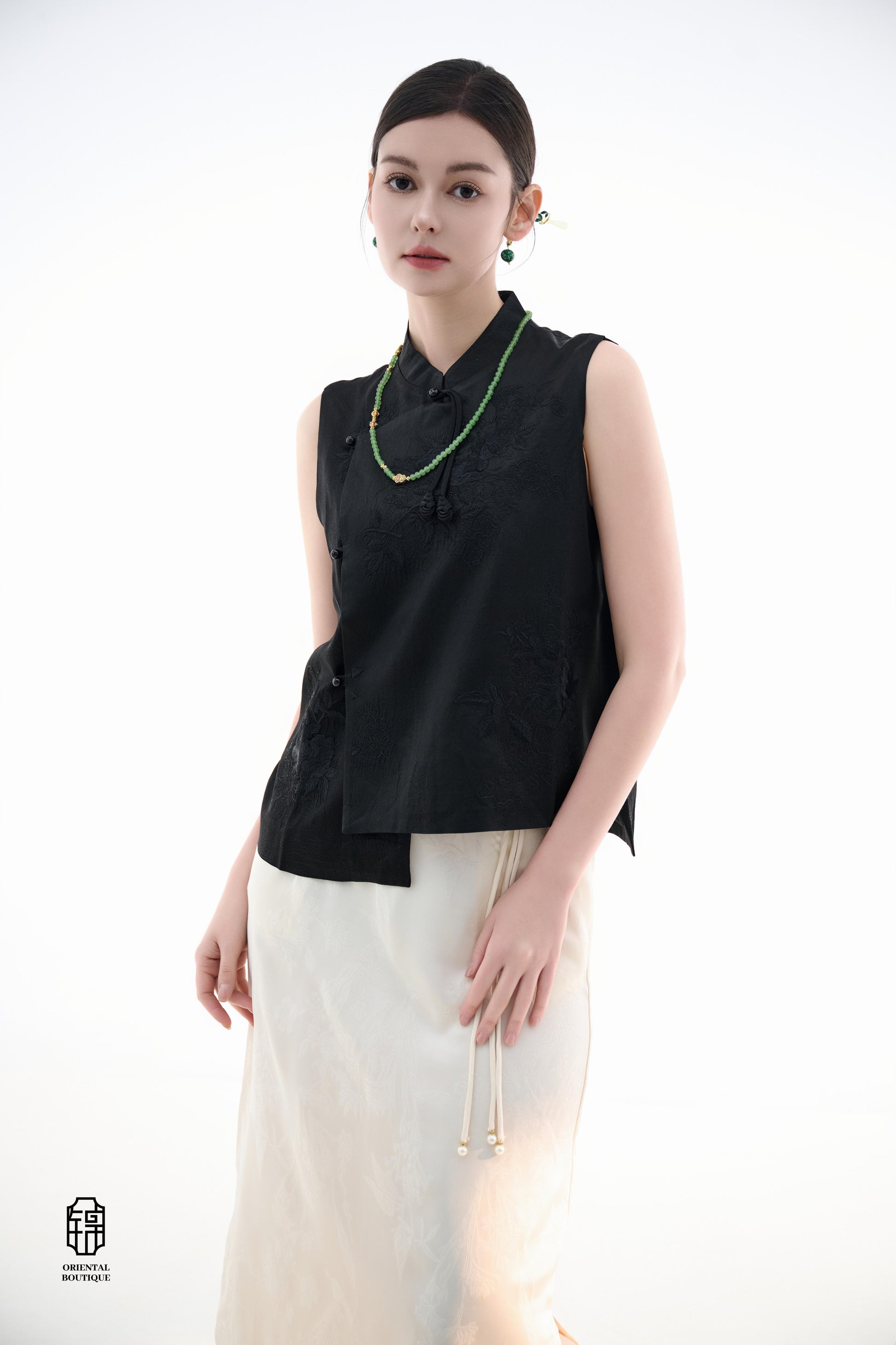 Black Lotus Sleeveless Top,The Black Lotus Sleeveless Top is a sophisticated sleeveless garment, featuring a sleek black tone crafted from luxurious silk fabric, offering a lightweight and smooth texture. The top is adorned with subtle jacquard embroidery