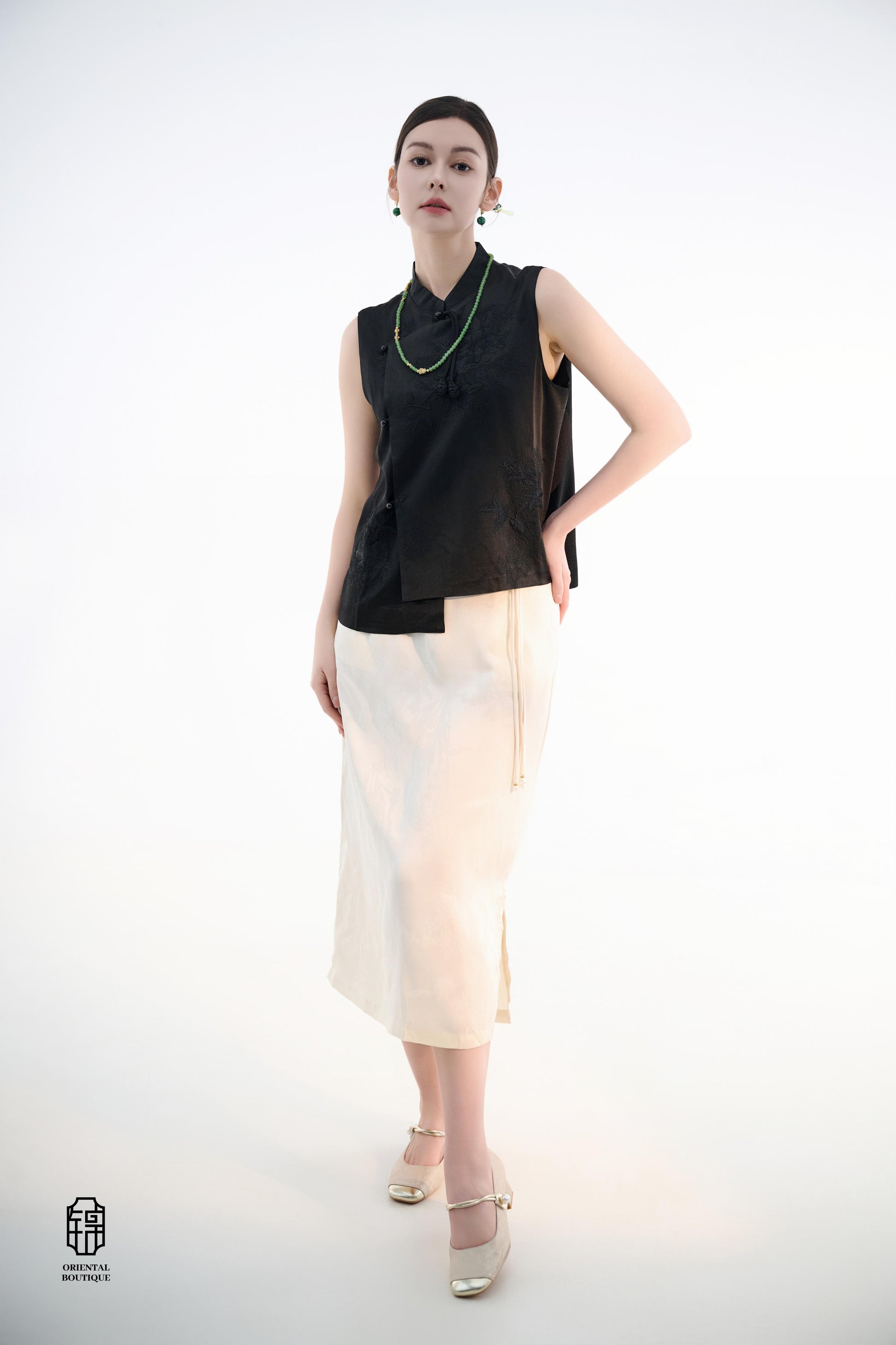 Black Lotus Sleeveless Top,The Black Lotus Sleeveless Top is a sophisticated sleeveless garment, featuring a sleek black tone crafted from luxurious silk fabric, offering a lightweight and smooth texture. The top is adorned with subtle jacquard embroidery