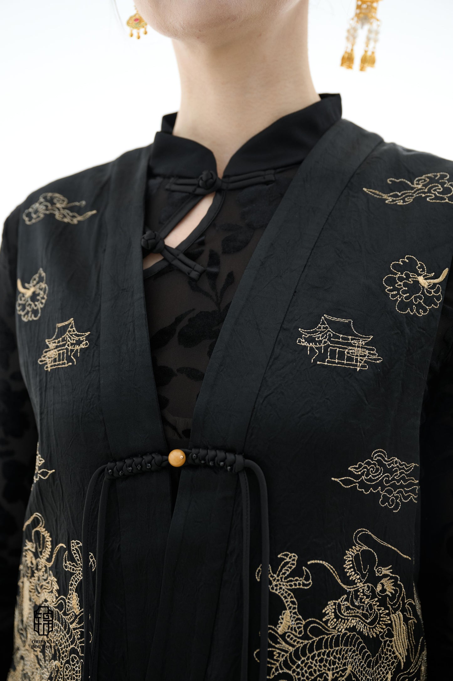 Dragon Soaring Brocade Vest,The Dragon Soaring Brocade Jacket features a deep black base with intricate golden dragon embroidery, exuding a dignified and regal aura. The front of the jacket is adorned with delicate gold thread patterns, depicting dragons,