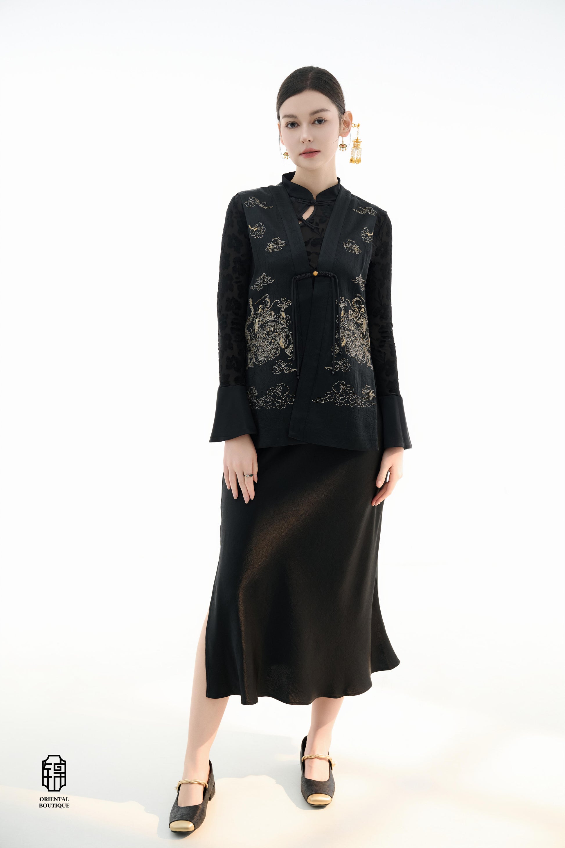 Dragon Soaring Brocade Vest,The Dragon Soaring Brocade Jacket features a deep black base with intricate golden dragon embroidery, exuding a dignified and regal aura. The front of the jacket is adorned with delicate gold thread patterns, depicting dragons,