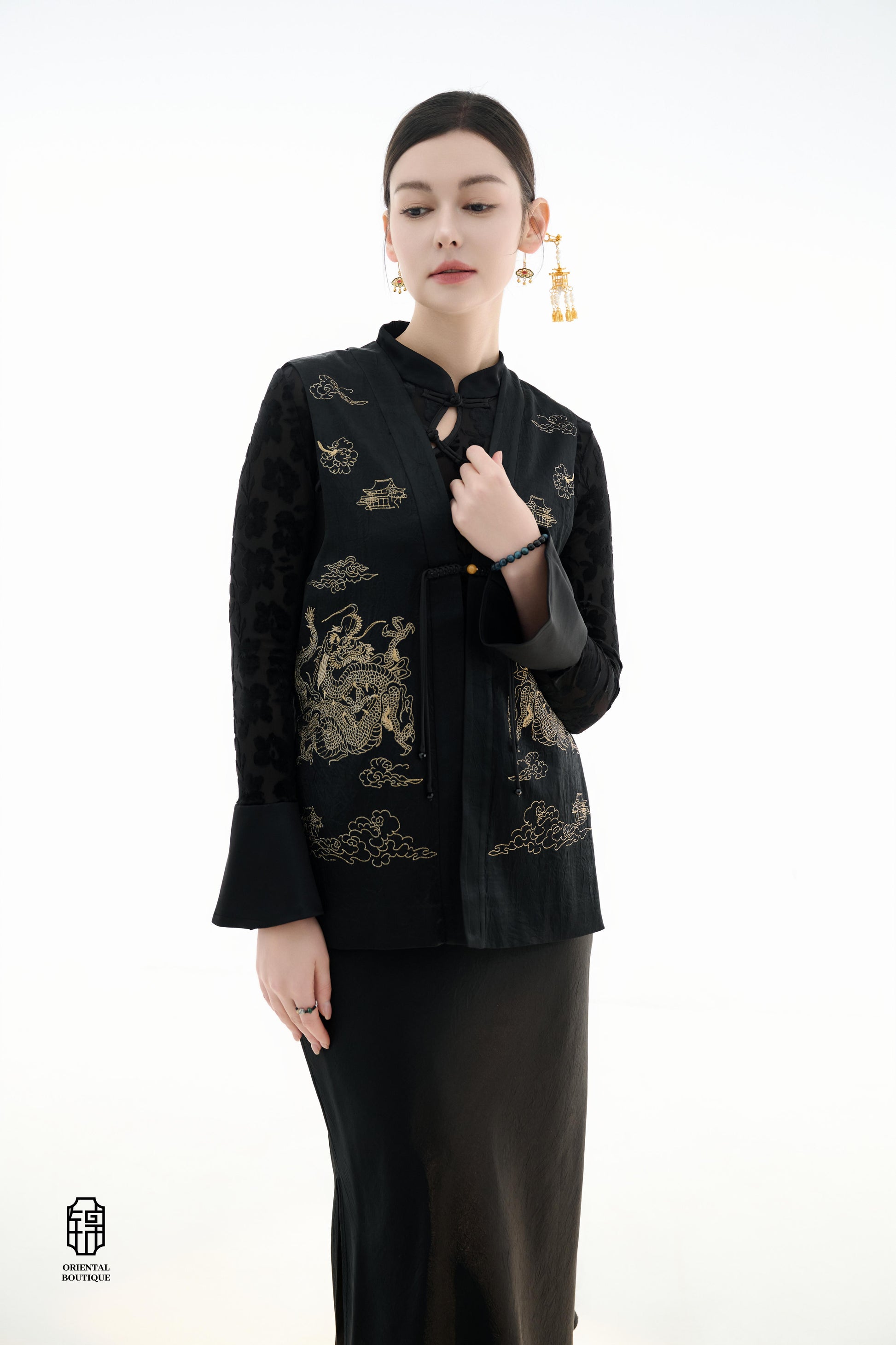 Dragon Soaring Brocade Vest,The Dragon Soaring Brocade Jacket features a deep black base with intricate golden dragon embroidery, exuding a dignified and regal aura. The front of the jacket is adorned with delicate gold thread patterns, depicting dragons,