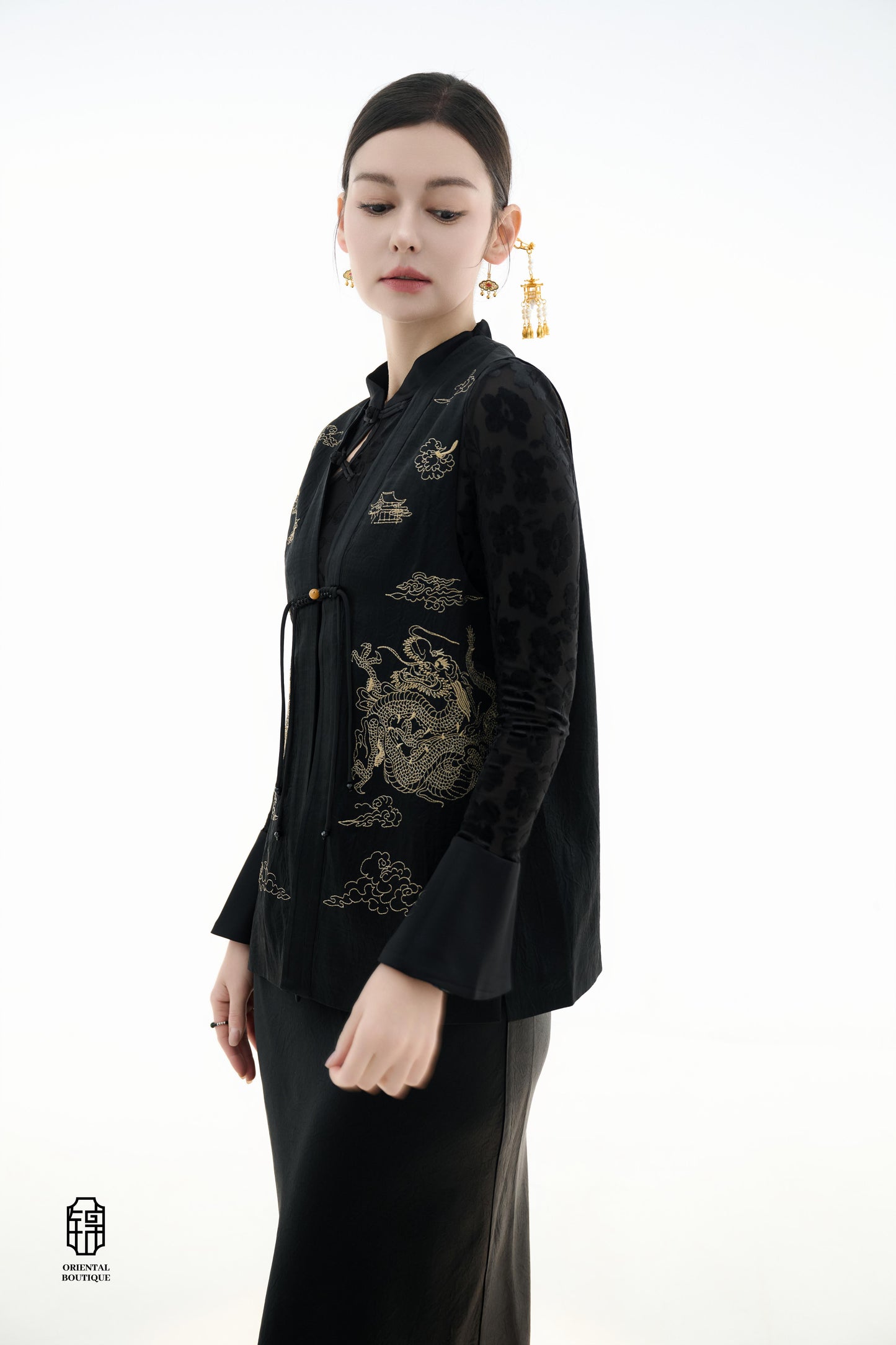 Dragon Soaring Brocade Vest,The Dragon Soaring Brocade Jacket features a deep black base with intricate golden dragon embroidery, exuding a dignified and regal aura. The front of the jacket is adorned with delicate gold thread patterns, depicting dragons,