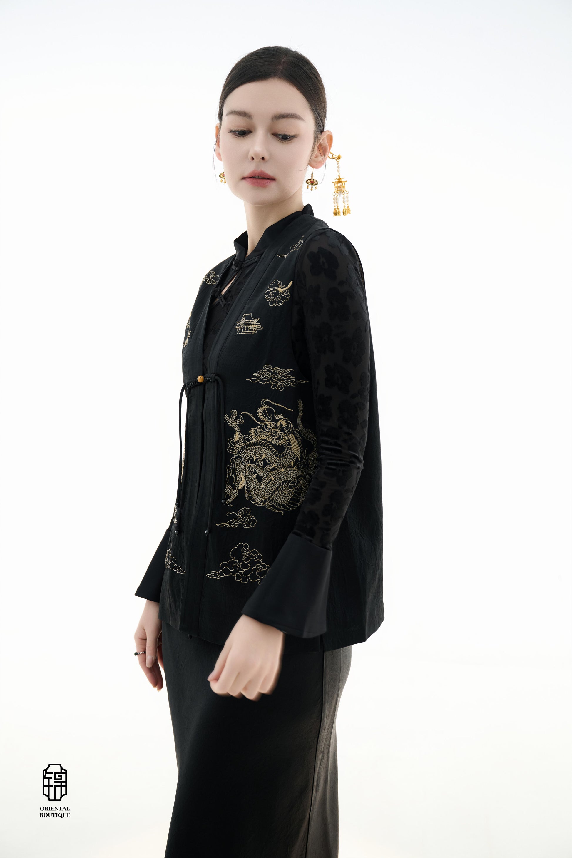 Dragon Soaring Brocade Vest,The Dragon Soaring Brocade Jacket features a deep black base with intricate golden dragon embroidery, exuding a dignified and regal aura. The front of the jacket is adorned with delicate gold thread patterns, depicting dragons,