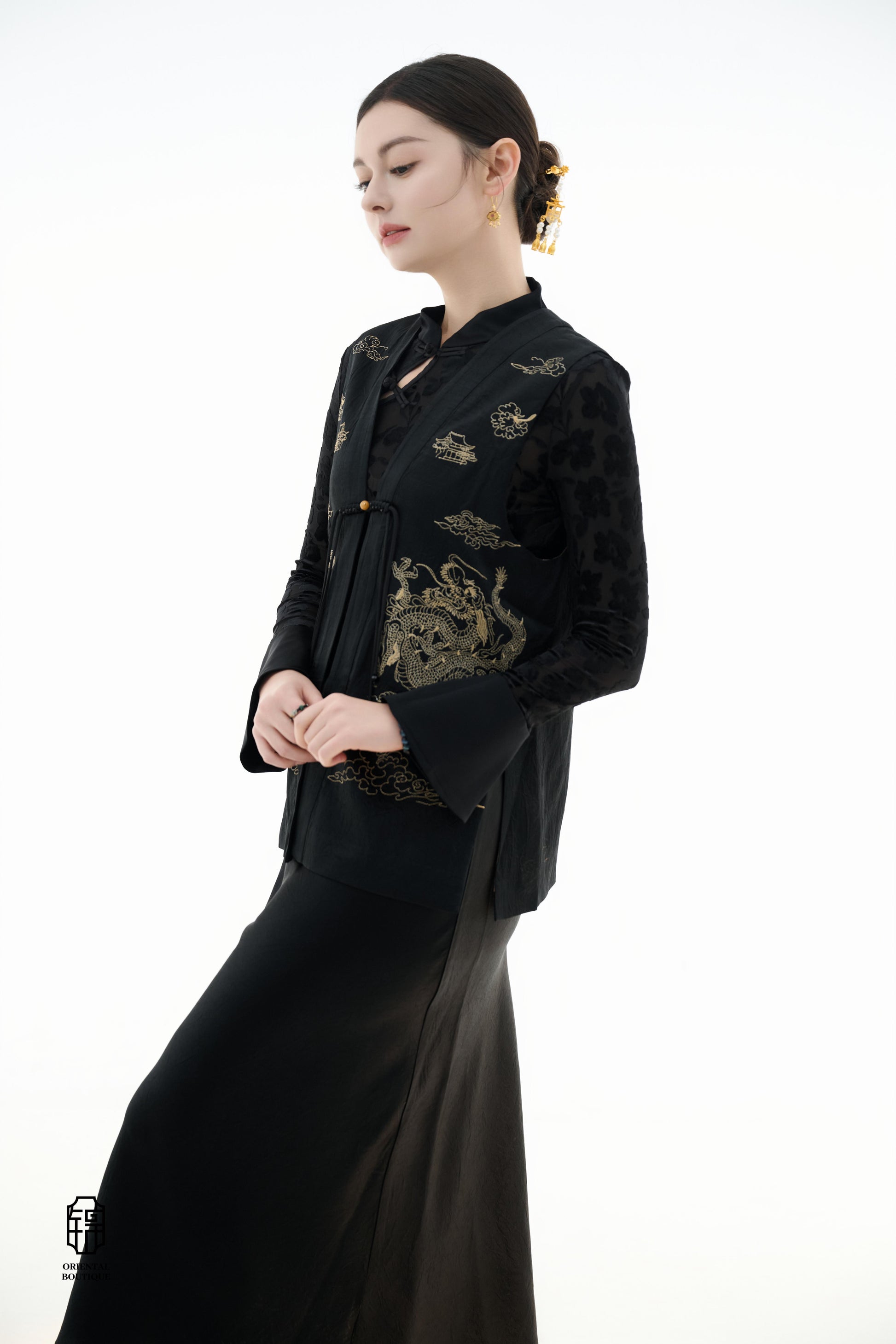 Dragon Soaring Brocade Vest,The Dragon Soaring Brocade Jacket features a deep black base with intricate golden dragon embroidery, exuding a dignified and regal aura. The front of the jacket is adorned with delicate gold thread patterns, depicting dragons,