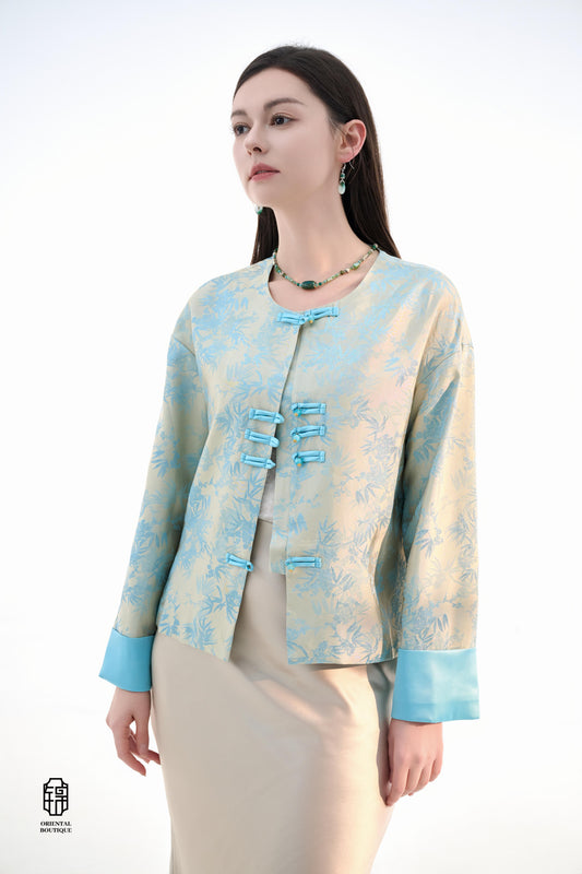 Bamboo Shadow Satin Long-Sleeve Top with Blue Knots,This Bamboo Shadow Satin Long-Sleeve Top features a graceful combination of light blue and beige with a subtle bamboo print. The design is accentuated by traditional Chinese blue knotted buttons and matc