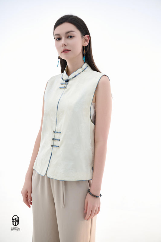 Cloud Brocade Mandarin Collar Sleeveless Vest,The Cloud Brocade Mandarin Collar Sleeveless Vest features a light brocade fabric, offering a simple and elegant look. The mandarin collar and traditional knotted buttons reflect the essence of classic Chinese